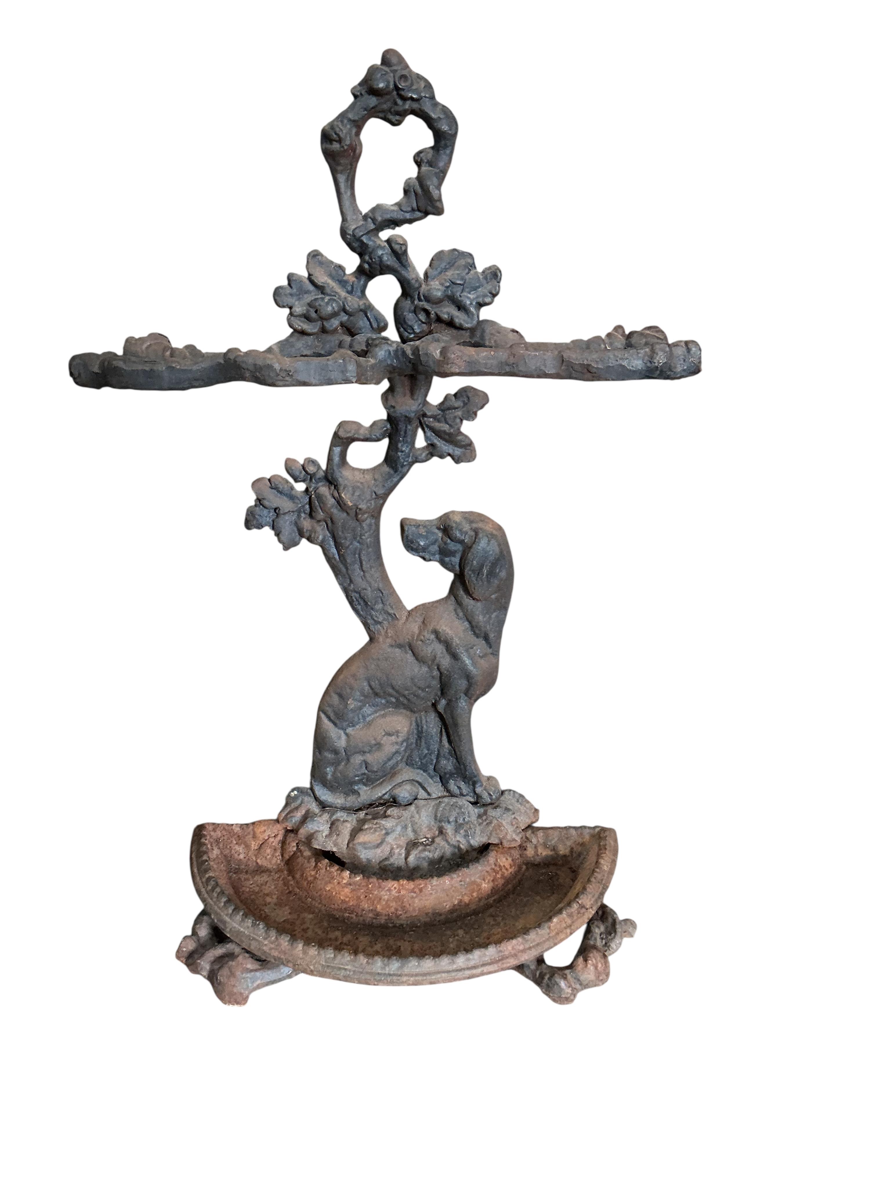 A Victorian Coalbrookdale style cast iron stick stand, width 42cm, height 70cm with semi circular drip tray
